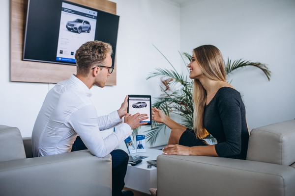Automotive business team reviewing payment and service tools